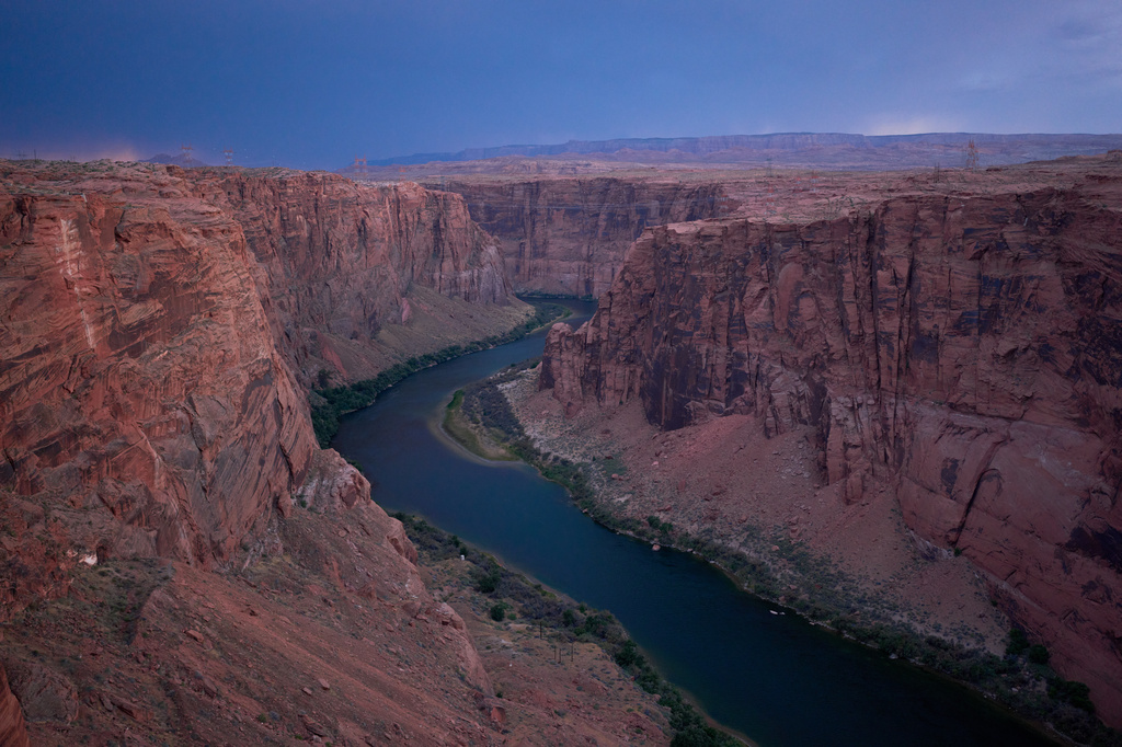 FILE - The Colorado River flows near the Glen Canyon Dam, July 15, 2026, near Page, Ariz. (AP Photo/John Locher, File)