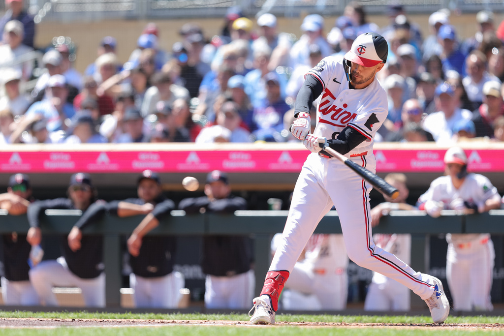Minnesota Twins' Trevor Larnach hits a single during the first inning of a baseball game against the Toronto Blue Jays, Sunday, May 3, 2026, in Minneapolis. (AP Photo/Bailey Hillesheim)