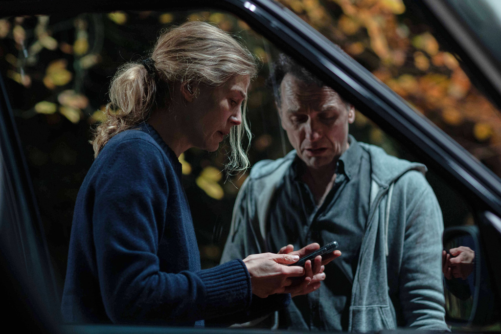 This image released by XYZ Films shows Rosamund Pike, left, and Matthew Rhys in a scene from "Hallow Road." (XYZ Films via AP)