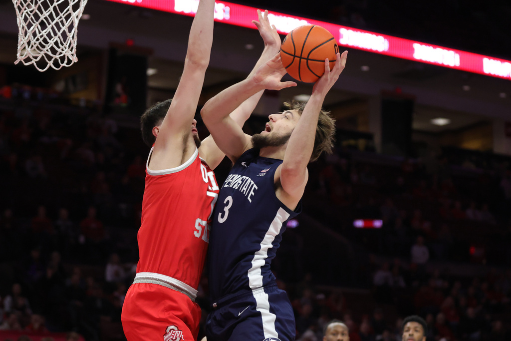 Penn State forward Ivan Juric, right, looks to shoot in front of Ohio State center Ivan Njegovan, left, during the first half of an NCAA college basketball game in Columbus, Ohio, Monday, Jan. 26, 2026. (AP Photo/Paul Vernon)