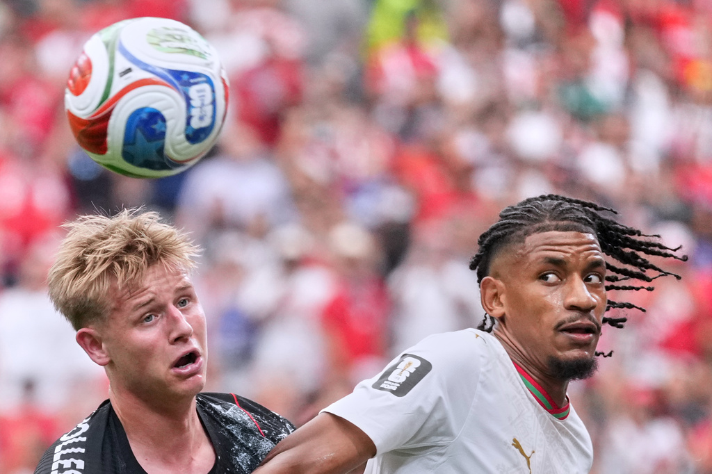 Canada's Luc de Fougerolles, left, and Morocco's Redouane Halhal vie for the ball during the World Cup round of 16 soccer match between Canada and Morocco in Houston, Saturday, July 4, 2026. (AP Photo/Eric Gay)