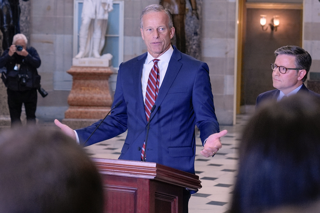 Senate Majority Leader John Thune, R-S.D., left, speaks during a news conference on Capitol Hill, Friday, Oct. 3, 2025, in Washington, as Speaker of the House Mike Johnson, R-La., looks on. (AP Photo/Mariam Zuhaib)