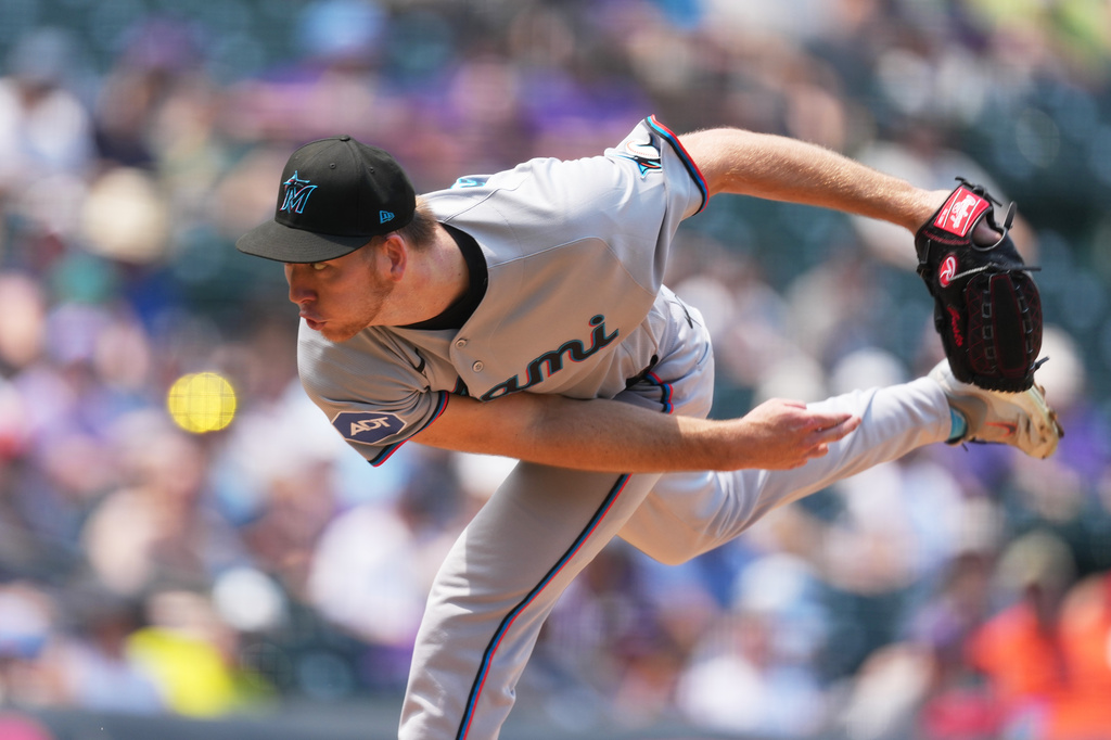 Miami Marlins starting pitcher Ryan Gusto works against the Colorado Rockies in the first inning of a baseball game Thursday, July 2, 2026, in Denver. (AP Photo/David Zalubowski)