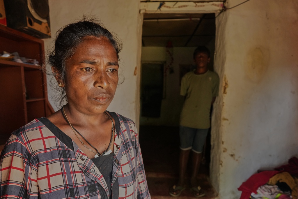 Arumugam Manikavalli stands at the doorway to her living quarters after Cyclone Ditwah led to floods and landslides at Craighead Estate in Nawalapitiya, Sri Lanka, Friday, Dec. 12, 2025. (AP Photo/Eranga Jayawardena)