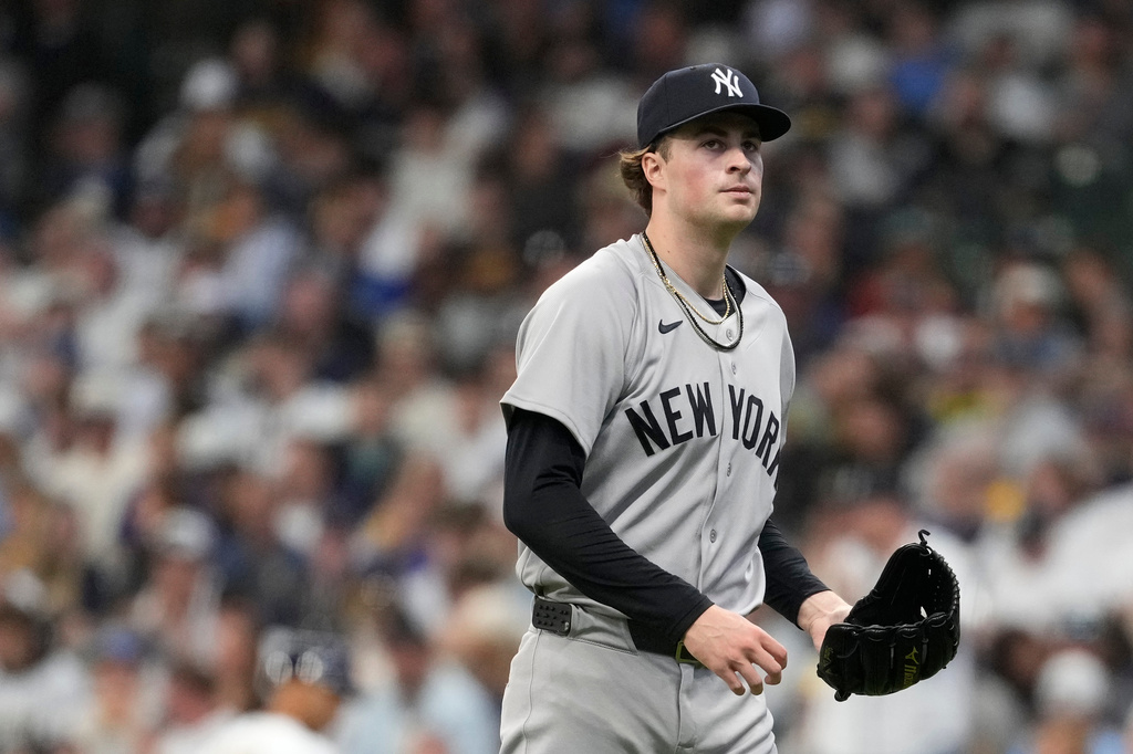 New York Yankees' Cam Schlittler walks to the dugout during the first inning of a baseball game against the Milwaukee Brewers, Saturday, May 9, 2026, in Milwaukee. (AP Photo/Aaron Gash)