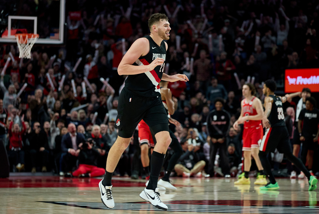 Portland Trail Blazers center Donovan Clingan reacts after making a three-point basket against the Chicago Bulls during the second half of an NBA basketball game in Portland, Ore., Wednesday, Nov. 19, 2025. (AP Photo/Craig Mitchelldyer)