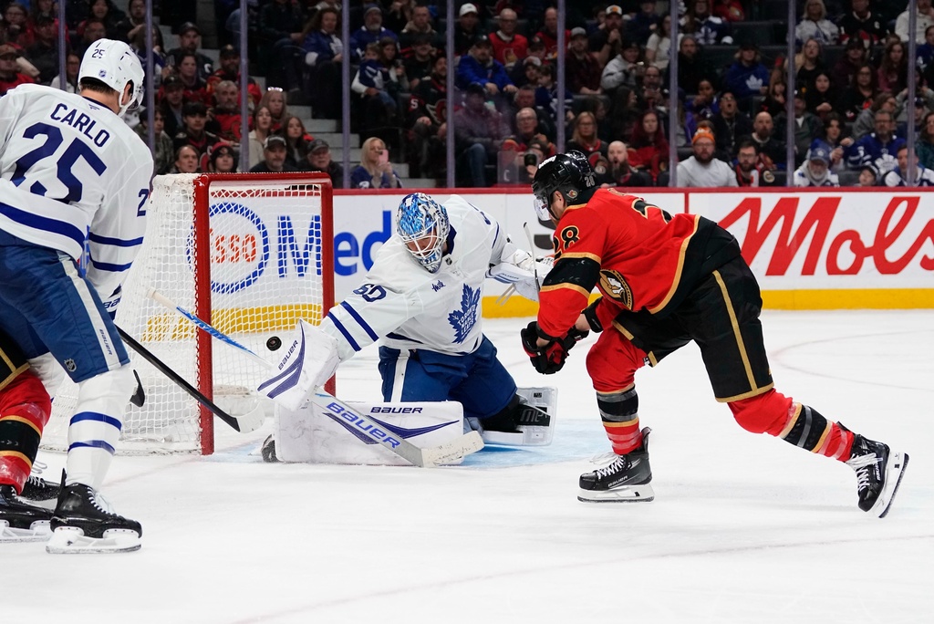 Ottawa Senators' Claude Giroux (28) scores against Toronto Maple Leafs goaltender Joseph Woll (60) during second-period NHL hockey game action in Ottawa, Ontario, Saturday, March 21, 2026. (Justin Tang/The Canadian Press via AP)