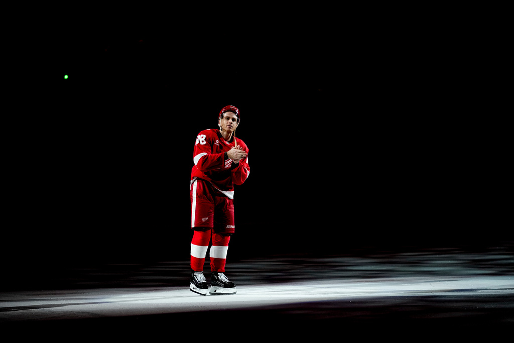 Detroit Red Wings right wing Patrick Kane greets fans after the team's win in NHL hockey game against the Vancouver Canucks after he scored his 500th career goal Thursday, Jan. 8, 2026, in Detroit. (AP Photo/Ryan Sun)