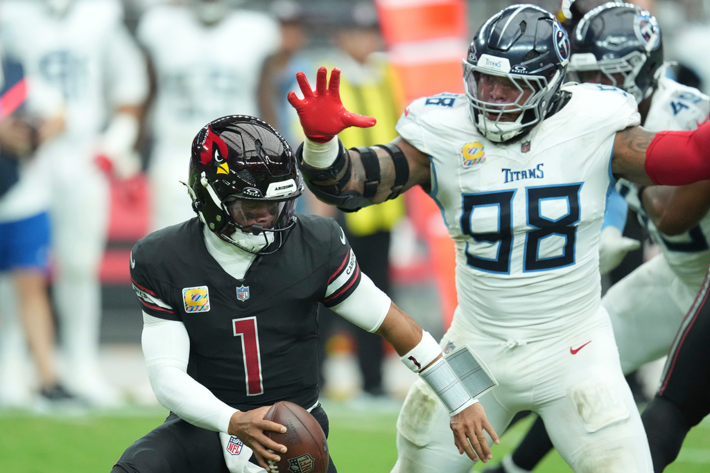 Tennessee Titans defensive tackle Jeffery Simmons (98) sacks Arizona Cardinals quarterback Kyler Murray (1) during the first half of an NFL football game Sunday, Oct. 5, 2025, in Glendale, Ariz. (AP Photo/Ross D. Franklin)