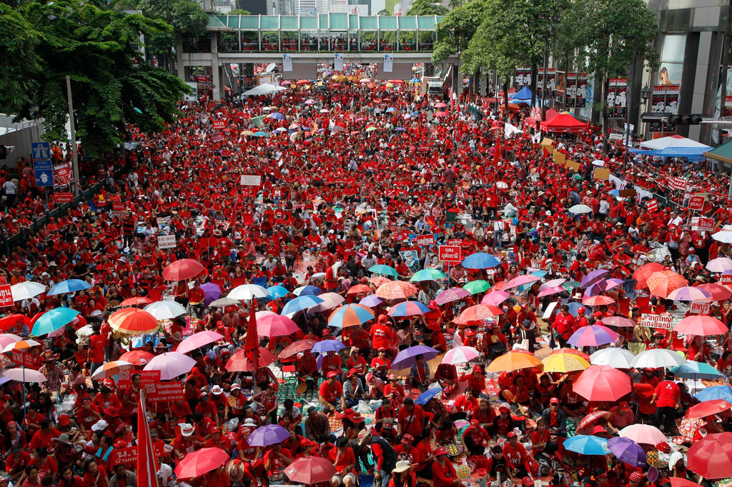FILE - "Red Shirts" protesters attend a prayer session marking the first anniversary of the army's crushing of a two-month-long protest in central Bangkok on May 19, 2011. (AP Photo/Sakchai Lalit, File)