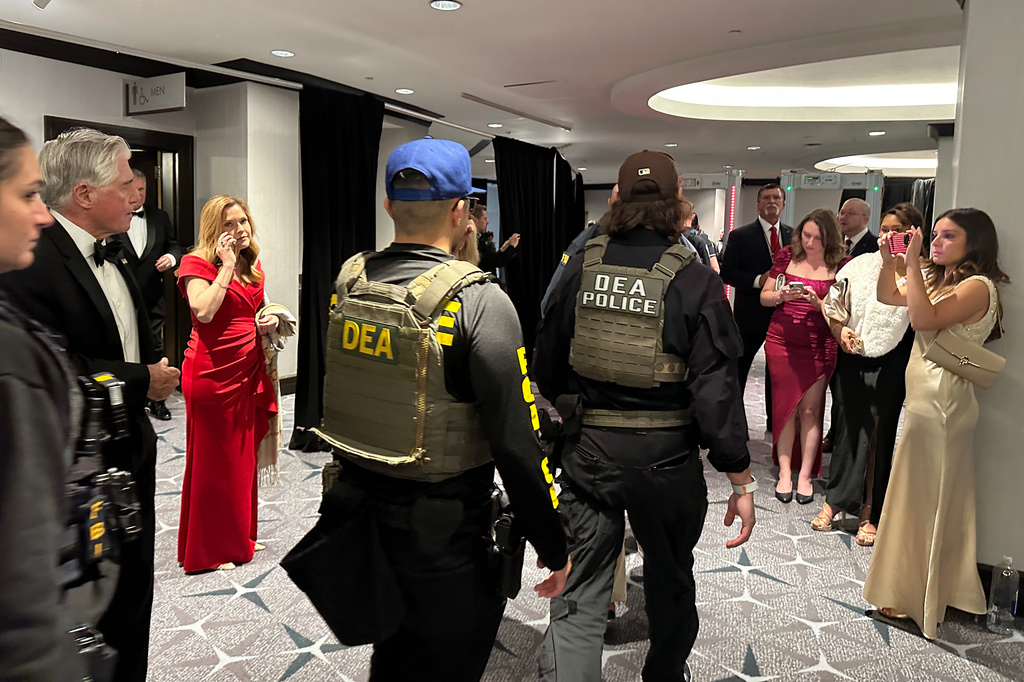Members of law enforcement respond after a shooting incident outside the ballroom during the White House Correspondents Dinner, Saturday, April 25, 2026, in Washington. (AP Photo/Alex Brandon)