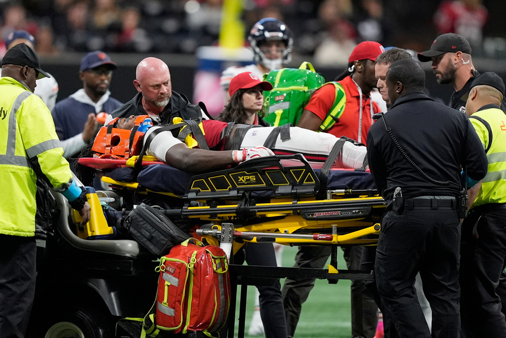 Atlanta Falcons linebacker Kendal Daniels is taken off the field after being injured during the second half of an NFL football game between the Falcons and the Chicago Bears in Atlanta, Sunday, Oct. 18, 2026. (AP Photo/Mike Stewart)