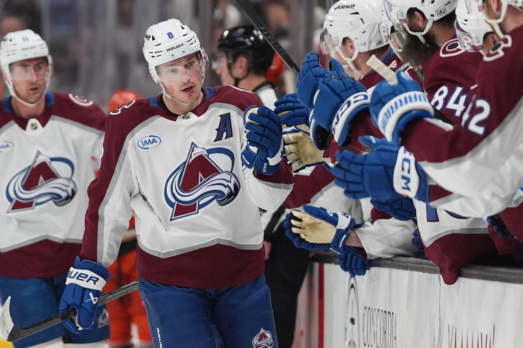 FILE - Colorado Avalanche defenseman Cale Makar, center, celebrates his goal with teammates during the first period of an NHL hockey game against the Anaheim Ducks, March 3, 2026, in Anaheim, Calif. (AP Photo/Gregory Bull, File)