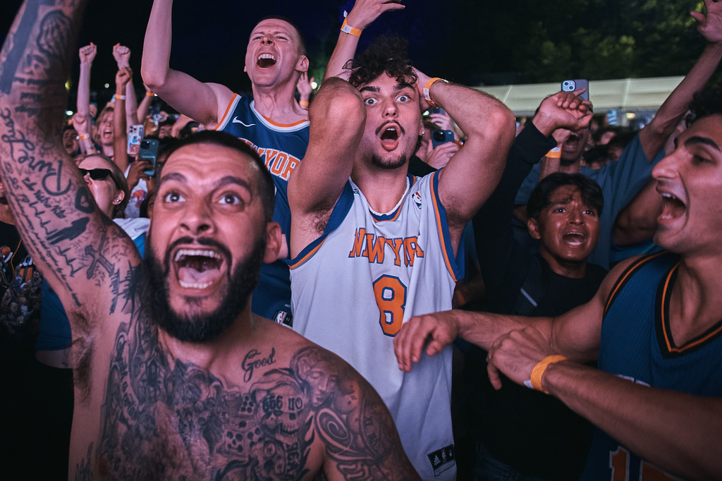 New York Knicks fans celebrate their victory as the watch Game 5 of the NBA Finals basketball series against the San Antonio Spurs, Saturday, June 13, 2026, in New York. (AP Photo/Andres Kudacki)