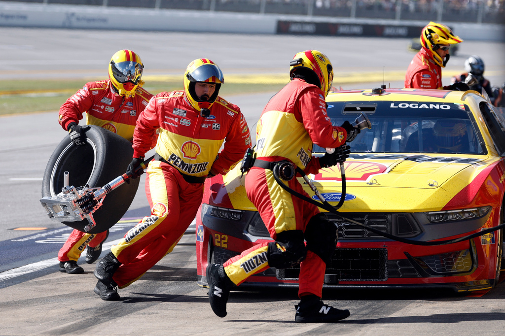 Joey Logano's crew change tires during a NASCAR Cup Series auto race, Sunday, April 26, 2026, in Talladega, Ala. (AP Photo/Butch Dill)