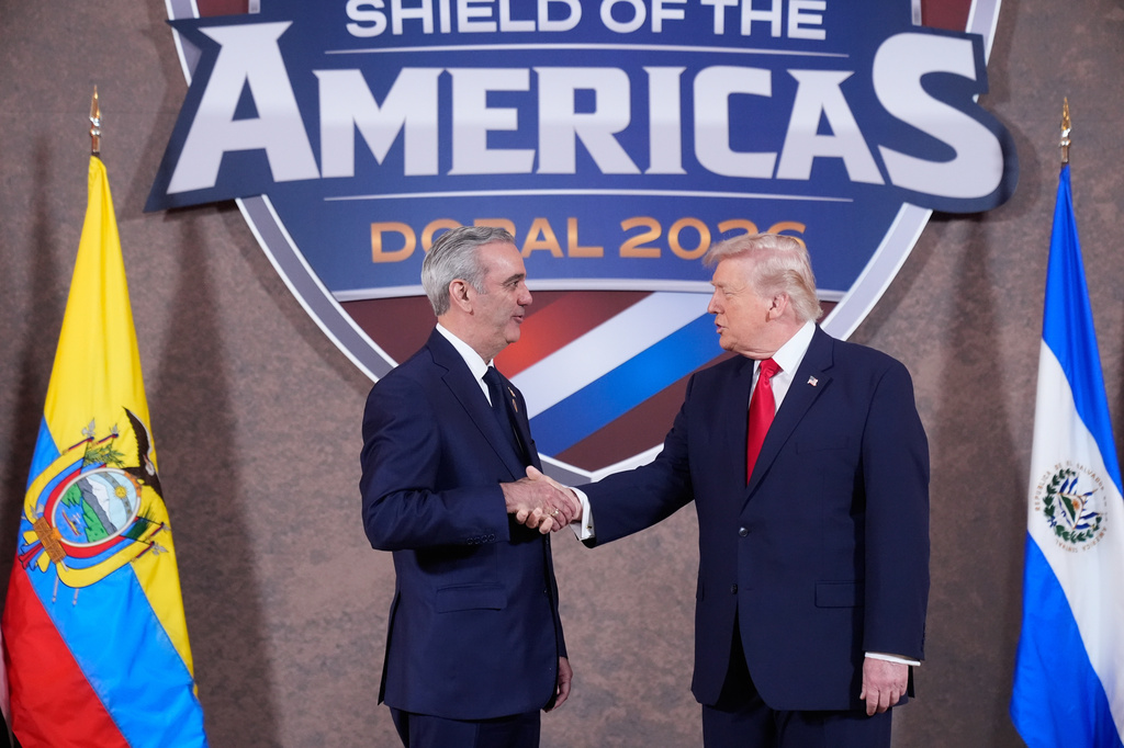 FILE - President Donald Trump greets President of the Dominican Republic Luis Abinader at the Shield of the Americas Summit, March 7, 2026, at Trump National Doral Miami in Doral, Fla. (AP Photo/Mark Schiefelbein, File)