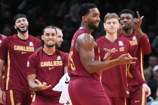 Cleveland Cavaliers guard Donovan Mitchell, center, celebrates with teammates after hitting a 3-pointer with less than a second on the clock to end the first quarter of an NBA basketball game against the Boston Celtics, Wednesday, Oct. 29, 2025, in Boston. (AP Photo/Charles Krupa) Cleveland Cavaliers guard Donovan Mitchell, center, celebrates with teammates after hitting a 3-pointer with less than a second on the clock to end the first quarter of an NBA basketball game against the Boston Celtics, Wednesday, Oct. 29, 2025, in Boston. (AP Photo/Charles Krupa)
