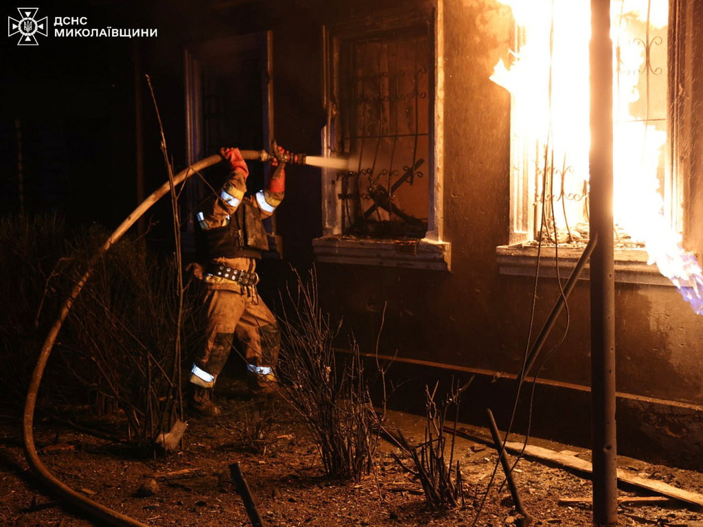 In this photo provided by the Ukrainian Emergency Service, firefighters put out a fire in a residential building following a Russian drone attack in Mykolayiv, Ukraine, Friday, May 1, 2026. (Ukrainian Emergency Service via AP)
