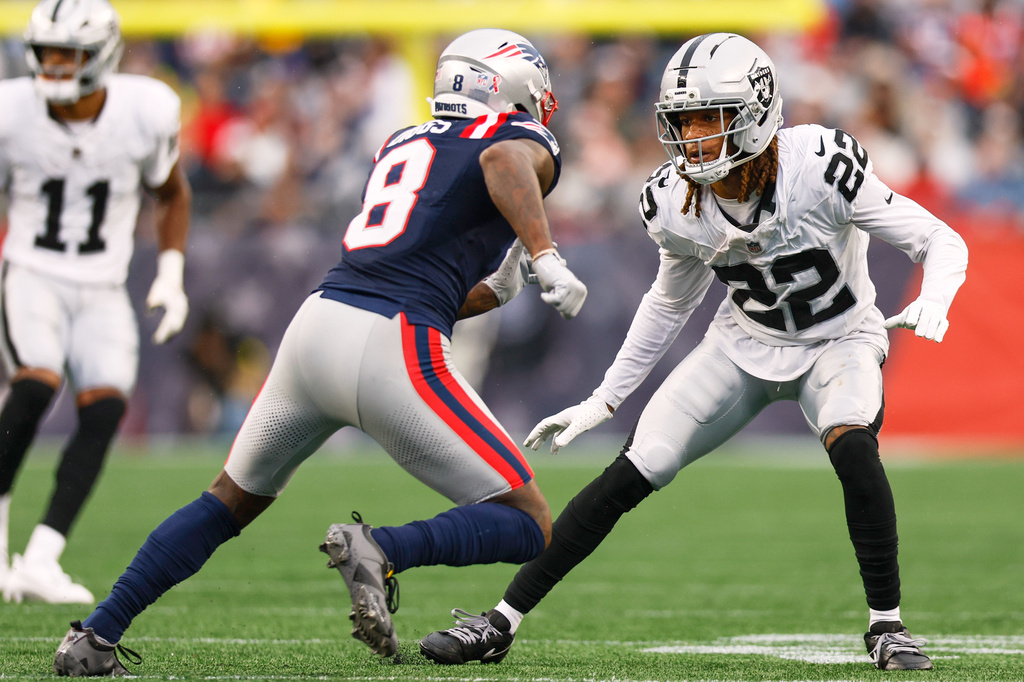 FILE - Las Vegas Raiders cornerback Eric Stokes (22) covers New England Patriots wide receiver Stefon Diggs (8) during the second half of an NFL football game Sept. 7, 2025, in Foxborough, Mass. (AP Photo/Greg M. Cooper, File)