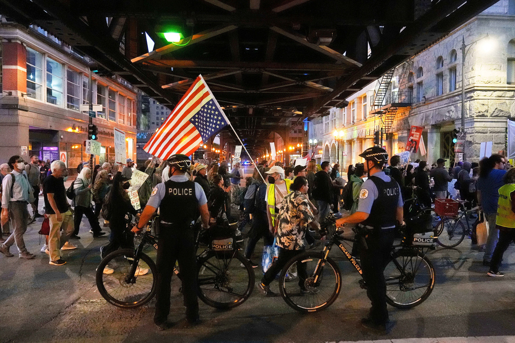FILE - Police officers block a street as demonstrators march at a protest opposing "Operation Midway Blitz" and the presence of ICE, Sept. 9, 2025, in Chicago. (AP Photo/Erin Hooley, File)