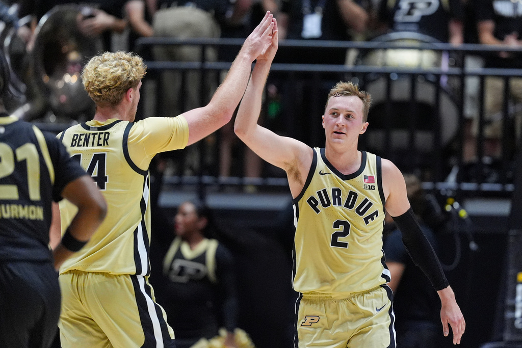 Purdue guard Fletcher Loyer (2) and Purdue guard Jack Benter (14) celebrated during the second half of an NCAA college basketball game against Oakland in West Lafayette, Ind., Friday, Nov. 7, 2025. (AP Photo/Michael Conroy)