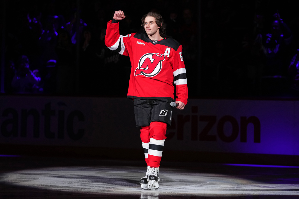 New Jersey Devils' Jack Hughes gestures to fans before an NHL hockey game against the Buffalo Sabres Wednesday, Feb. 25, 2026, in Newark, N.J. (AP Photo/Frank Franklin II)