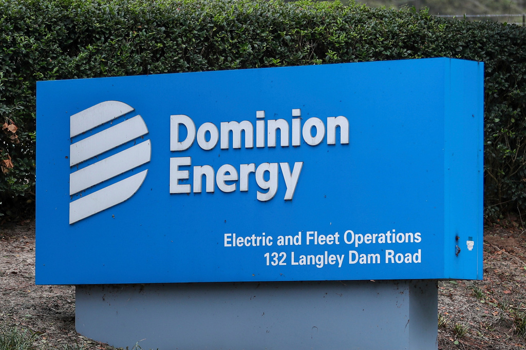 FILE - The Dominion Energy sign outside of the Electric and Fleet Operations center in the aftermath of Hurricane Helene on Sept. 29, 2024, in Aiken, S.C. (AP Photo/Artie Walker Jr., File)