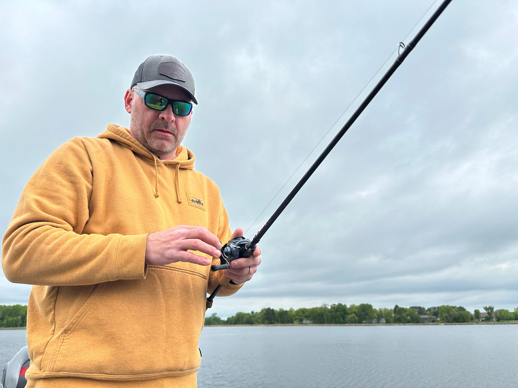Terry Rehm casts for fish Saturday, May 23, 2026 in Nowthen, Minn. (AP Photo/Mark Vancleave)