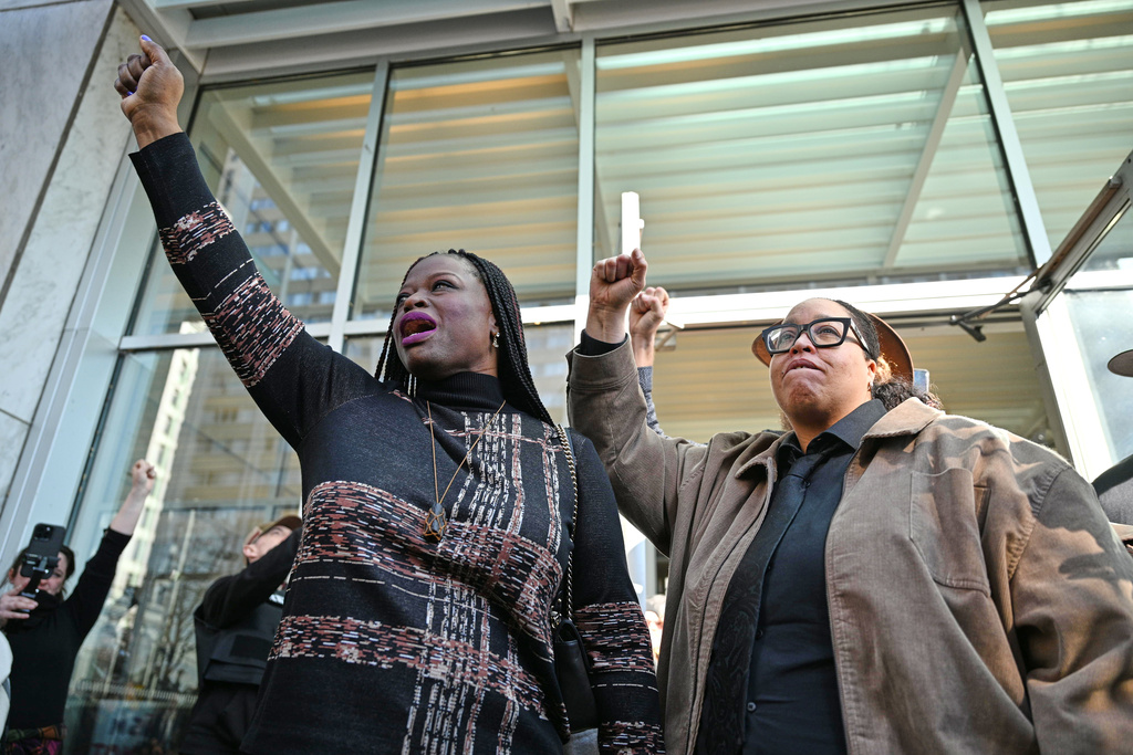 Nekima Levy Armstrong, left, speaks to the media alongside Chauntyll Allen, right, outside the U.S. District Courthouse in St. Paul, Minn., Friday, Feb. 13, 2026. (AP Photo/Tom Baker)