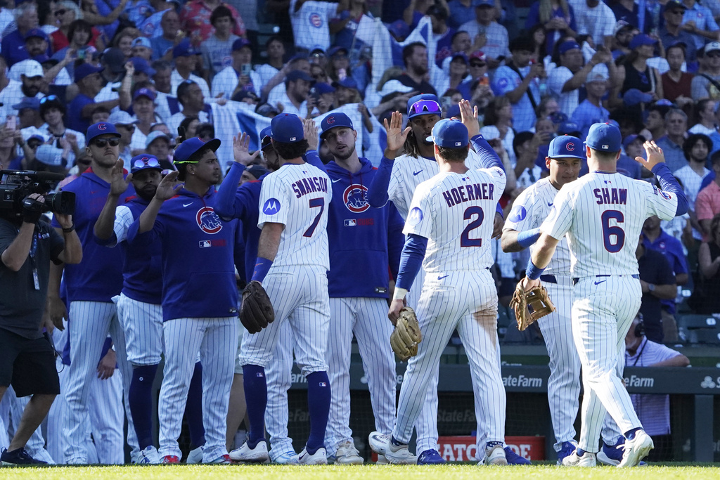 The Chicago Cubs celebrate their win against the Tampa Bay Rays in a baseball game Sunday, Sept. 14, 2025, in Chicago. (AP Photo/David Banks)