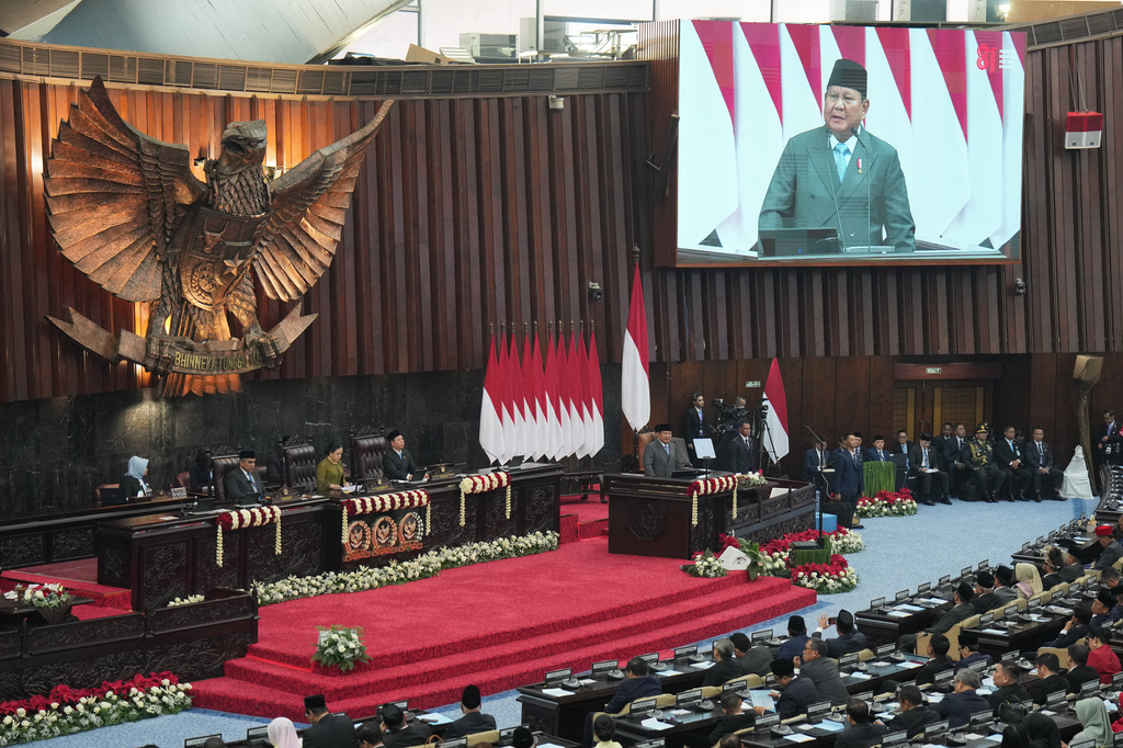 Indonesian President Prabowo Subianto, center, delivers his annual State of the Nation Address ahead of the country's Independence Day, at the parliament building in Jakarta, Indonesia, Friday, Aug. 14, 2026. (AP Photo/Dita Alangkara)