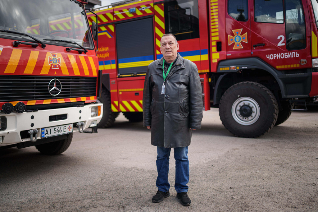 Stanislav Tolumnyi, 65, a firefighter who worked to decontaminate areas near the Chernobyl nuclear power plant after the 1986 accident, poses for a portrait, Tuesday, April 21, 2026, in Chernobyl, Ukraine, at a fire department where he served from 1987 to 1988. (AP Photo/Evgeniy Maloletka)