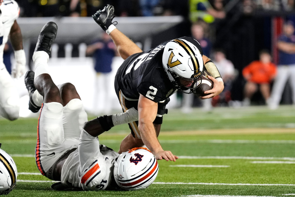 Vanderbilt quarterback Diego Pavia (2) is tackled by Auburn linebacker Bryce Deas (16) on a fourth down play during the second half of an NCAA college football game Saturday, Nov. 8, 2025, in Nashville, Tenn. (AP Photo/George Walker IV)