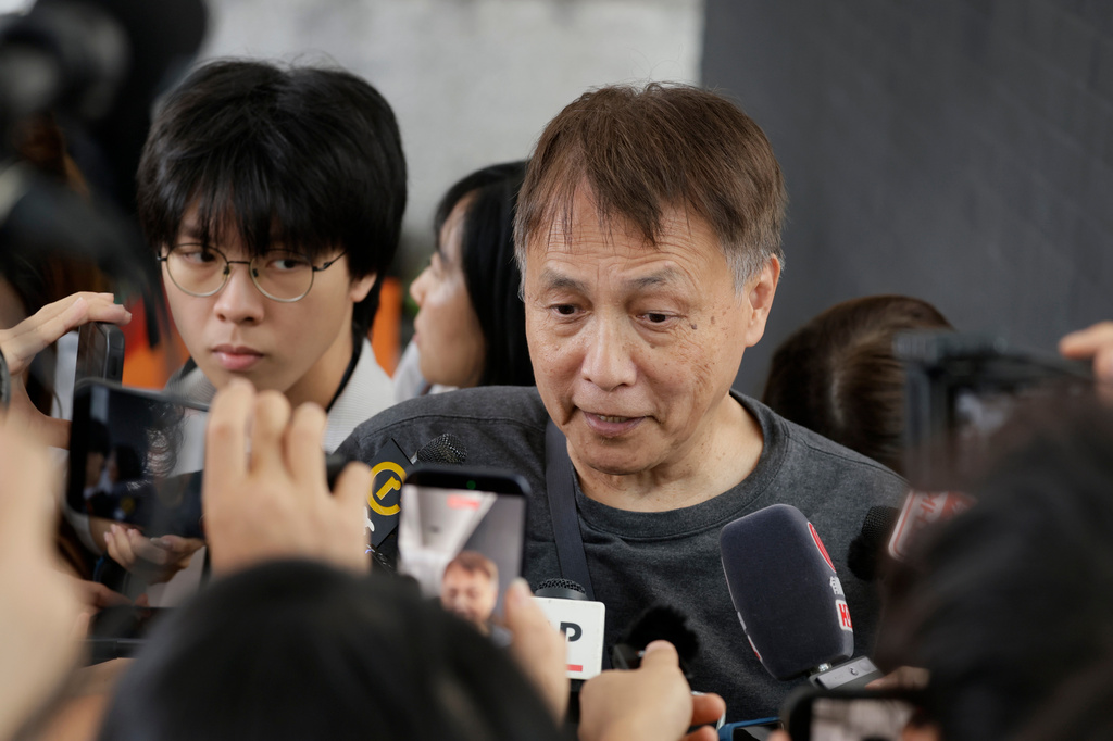 Lee Kwok-hung, speaks to the media following the closing submissions at the hearing of an independent committee investigating last year's Tai Po fire, in Hong Kong, Friday, July 17, 2026. (AP Photo/May James)