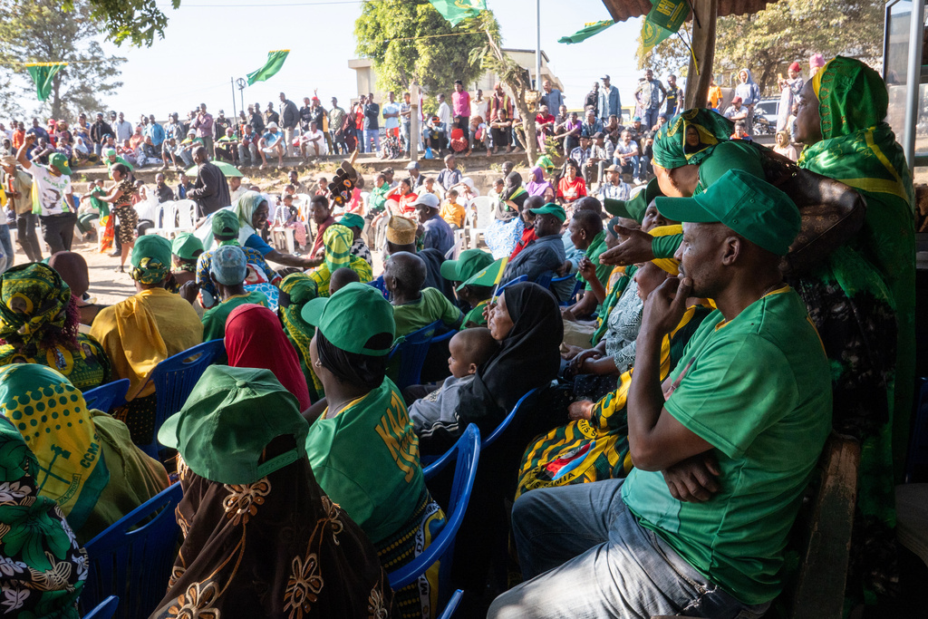 Supporters of Tanzanian presidential candidate Samia Suluhu Hassan, of the ruling Chama Cha Mapinduzi party, listen to speeches during a campaign rally in Arusha, Tanzania, Oct. 11, 2025. (AP Photo)