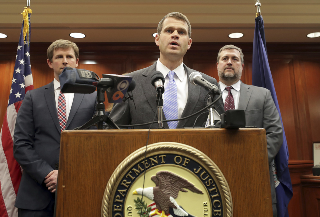 FILE - U.S. Attorney Thomas Cullen, center, speaks with the media in Charlottesville Federal Court in Charlottesville, Va, March 27, 2019. (Andrew Shurtleff/The Daily Progress via AP, File)