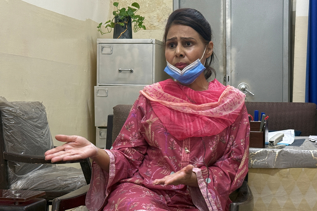 Nurse Razia Noreen, who risked her life to save a newborn during a fire at the Pakistan Institute of Medical Sciences, speaks during an interview in Islamabad, Tuesday, Sept. 1, 2026. (AP Photo/M.Yousaf)