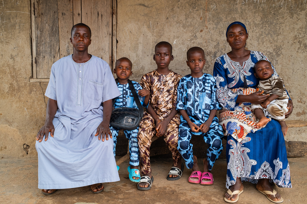 Aliyu Saheed and his wife pose for a photograph with his children that were released after being kidnapped with others from a school by al-Qaida-linked fighters in Esinele, Southwestern, Nigeria, July 17, 2026. (AP Photo/Pelumi Salako)