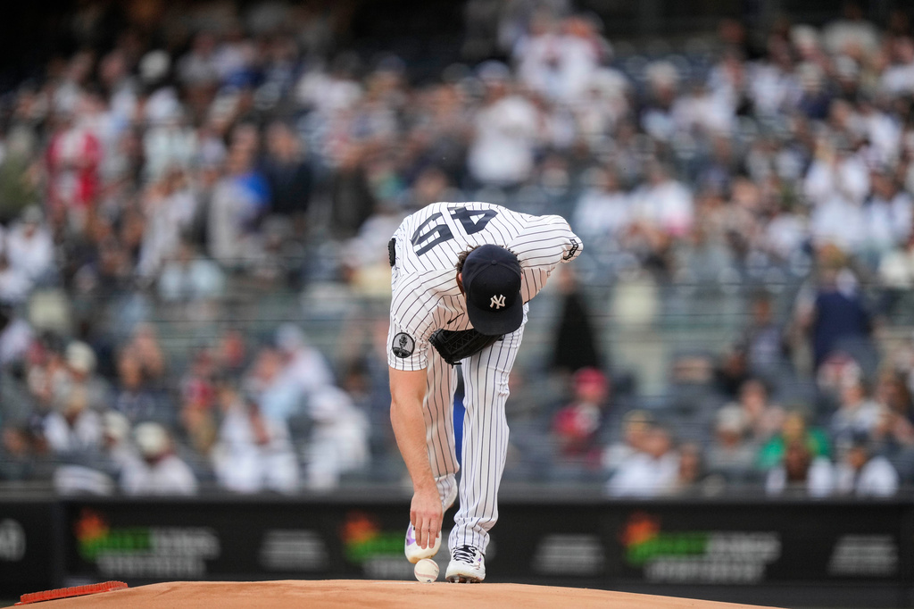 New York Yankees pitcher Gerrit Cole picks up the ball before a baseball game against the Tampa Bay Rays, Friday, May 22, 2026, in New York. (AP Photo/Yuki Iwamura)