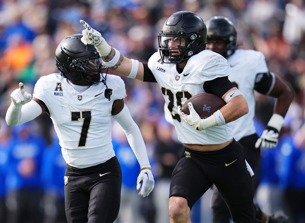 Army safety Casey Larkin (20) celebrates an interception against Air Force during the first half of an NCAA college football game, Saturday, Nov. 1, 2025, in Air Force Academy, Colo. (AP Photo/Jack Dempsey)