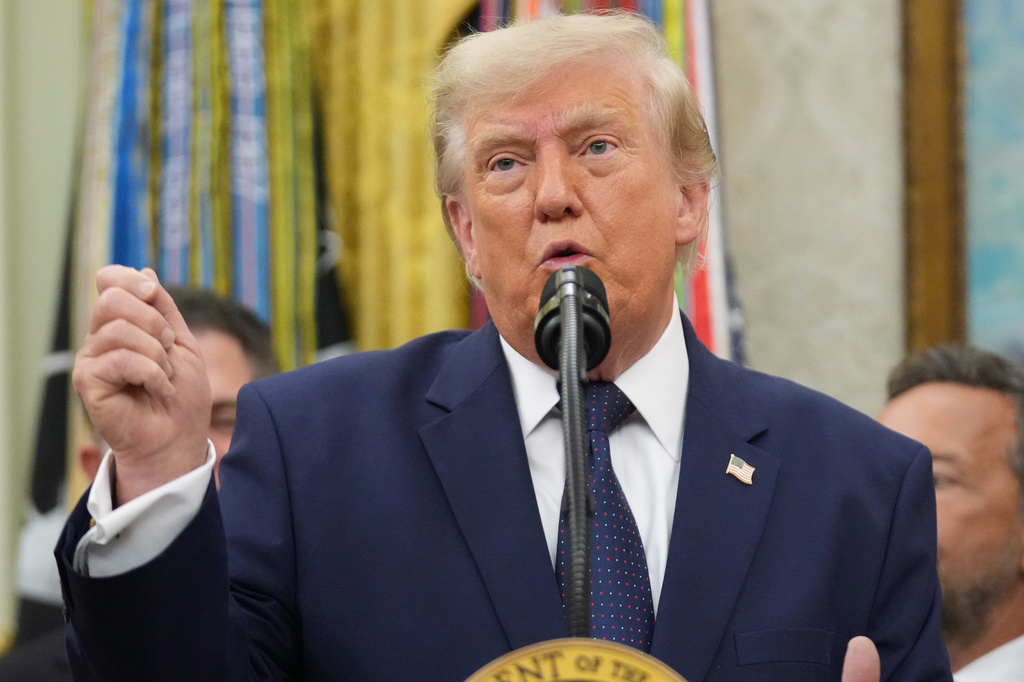President Donald Trump speaks about FIFA after ringing the opening bell for the New York Stock Exchange and the Nasdaq in the Oval Office at the White House, Monday, July 6, 2026, in Washington. (AP Photo/Mark Schiefelbein)