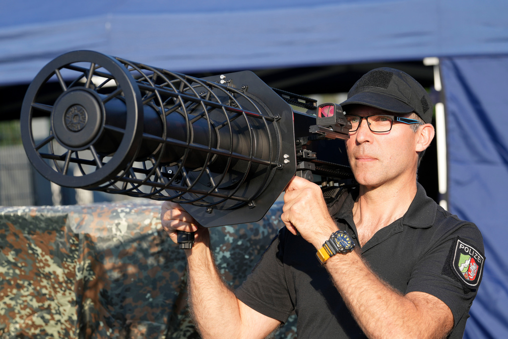 FILE - A police man demonstrates the new police drone defence unit on the occasion of the European Football Championship prior the international friendly soccer match between Germany and Greece at the Borussia Park in Moenchengladbach, Germany, June 7, 2024. (AP Photo/Martin Meissner, File)