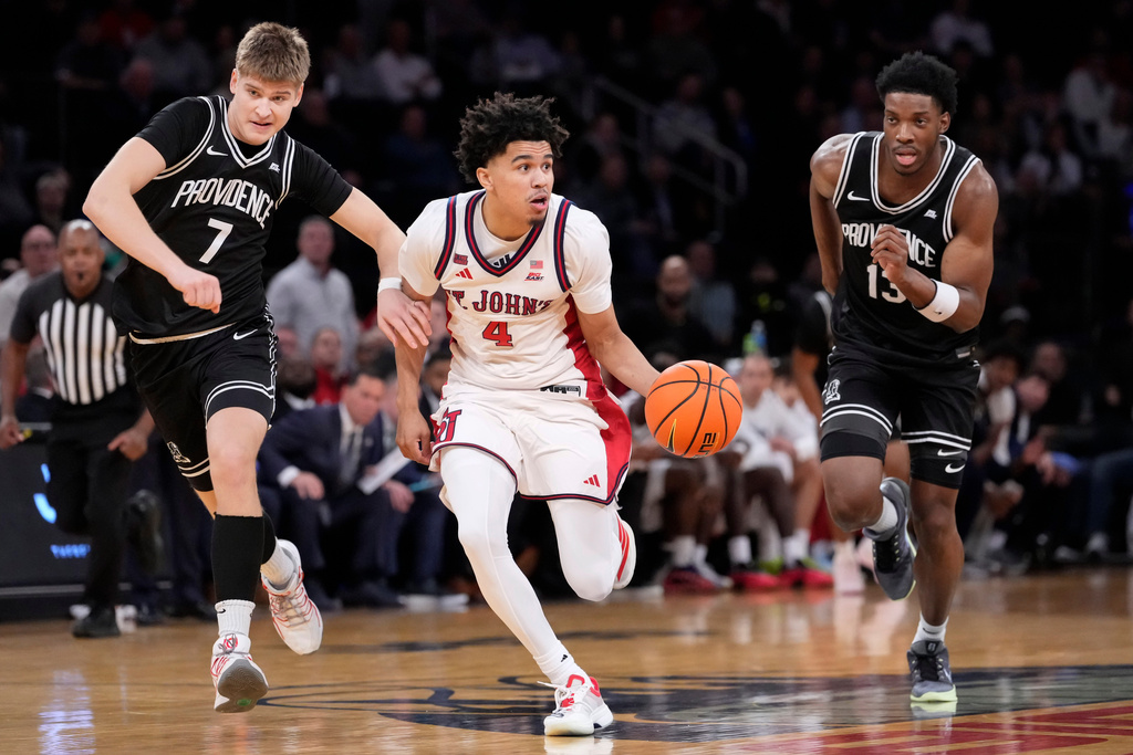 St. John's guard Oziyah Sellers (4) looks to pass away during the first half of an NCAA college basketball game against the Providence in the quarterfinals of the Big East tournament, Thursday, March 12, 2026, in New York. (AP Photo/Yuki Iwamura)