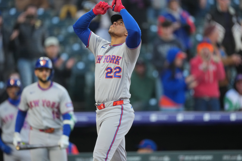 New York Mets' Juan Soto gestures as he crosses home plate after hitting a solo home run off Colorado Rockies starting pitcher Michael Lorenzen in the first inning of a baseball game, Wednesday, May 6, 2026, in Denver. (AP Photo/David Zalubowski)