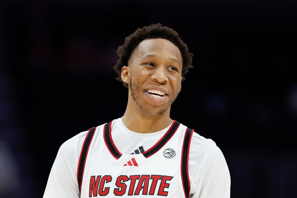 NC State guard Quadir Copeland laughs during the second half of an NCAA college basketball game against Pittsburgh in the second round of the Atlantic Coast Conference tournament in Charlotte, N.C., Wednesday, March 11, 2026. (AP Photo/Nell Redmond)