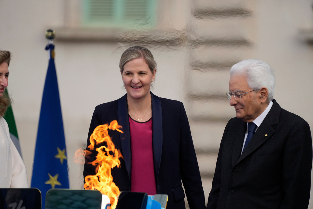 Italian President Sergio Mattarella is flanked by nternational Olympic Committee President Kirsty Coventry during the Milan Cortina 2026 Winter Olympics cauldron lighting, in front of the Quirinale Presidential Palace, in Rome, Friday Dec. 5, 2025. (AP Photo/Gregorio Borgia)