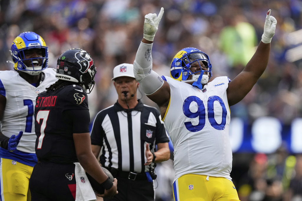 Los Angeles Rams defensive end Tyler Davis (90) celebrates after sacking Houston Texans quarterback C.J. Stroud (7) during the second half of an NFL football game, Sunday, Sept. 7, 2025, in Inglewood, Calif. (AP Photo/Mark J. Terrill)