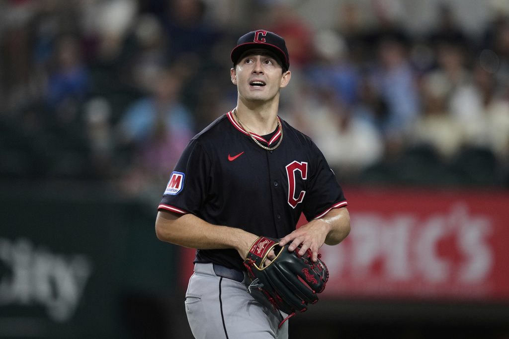 Cleveland Guardians starting pitcher Logan Allen walks off the field and to the dugout after working against the Texas Rangers in the fifth inning of a baseball game Saturday, Aug. 23, 2025, in Arlington, Texas. (AP Photo/Tony Gutierrez)