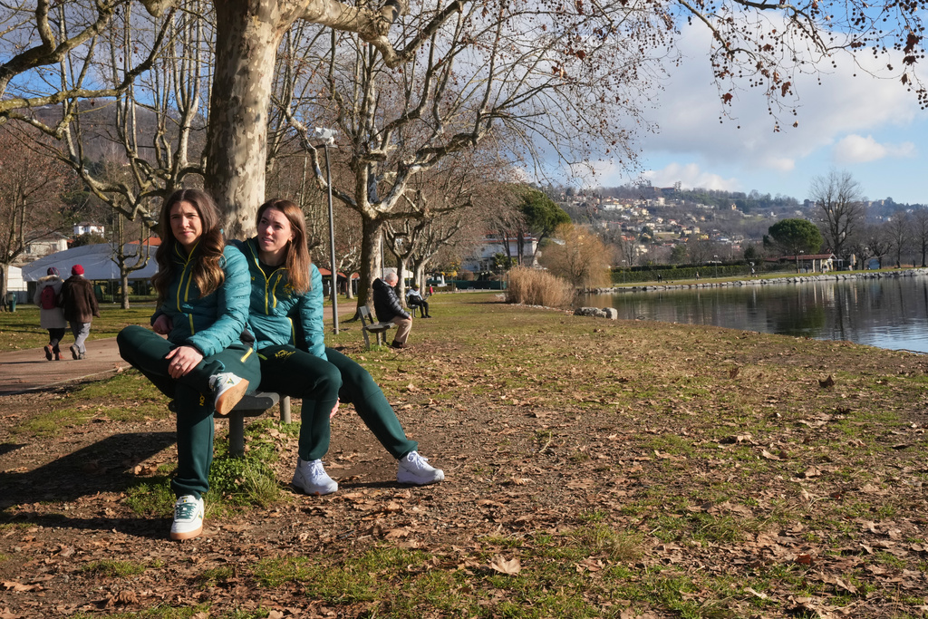 Australia's Breeana Walker, left, and Kiara Reddingius sit at the AIS European Training Centre in Gavirate, on the Varese lake, northern Italy, Monday, Jan. 26, 2026. (AP Photo/Antonio Calanni)