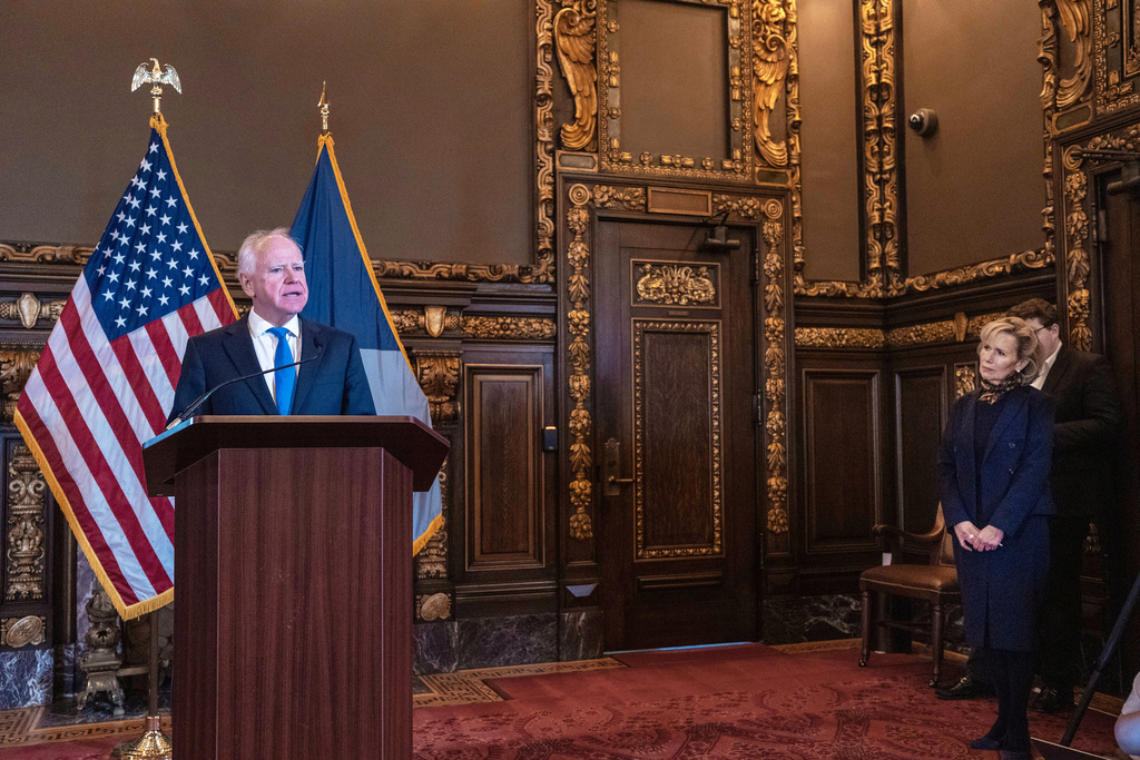 Minnesota Governor Tim Walz, with his wife Gwen Walz looking on announces that he would not be seeking reelection Monday, Jan. 5, 2026 in St. Paul, Minn. (Jerry Holt/Star Tribune via AP)